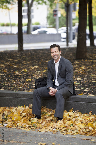 Businessman Relaxing At The Park