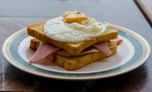 fried egg and ham sandwich on toast.