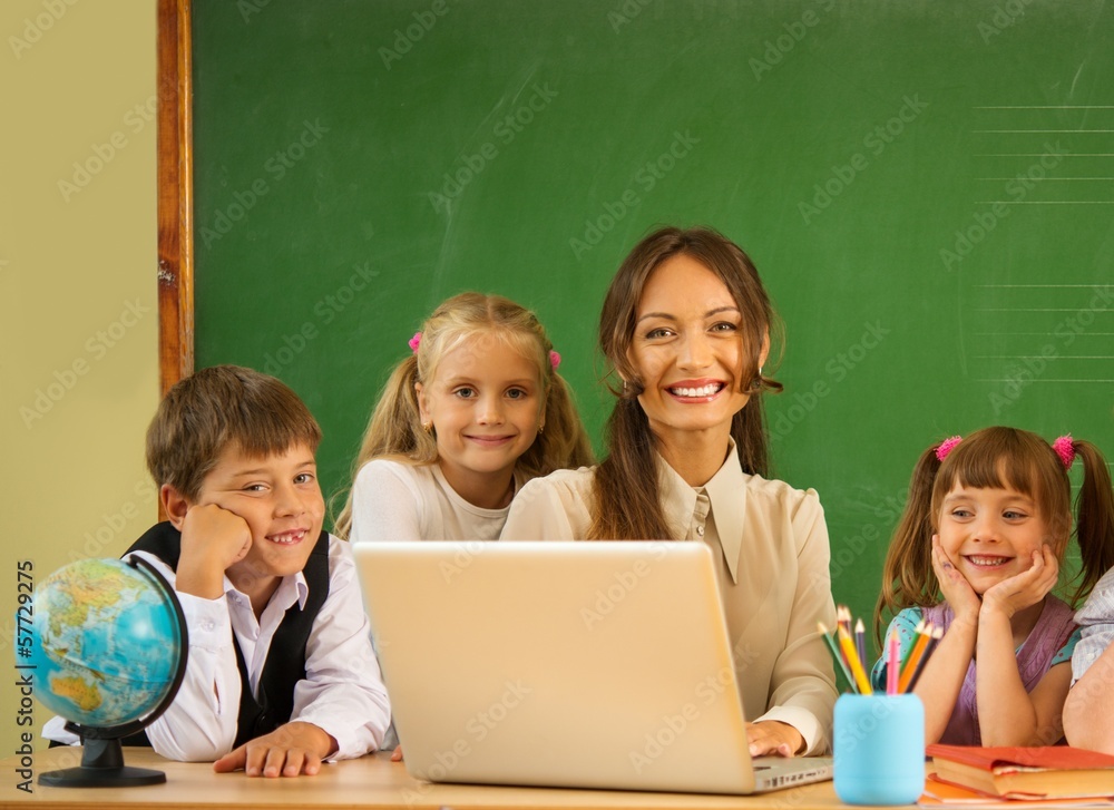 Group of happy classmates with their teacher Group of happy classmates with their teacher