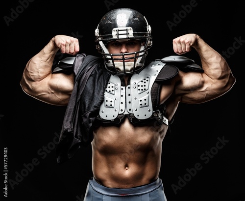 American football player wearing helmet and protective armour
