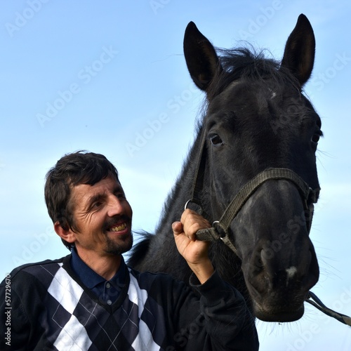 A young man with a horse.