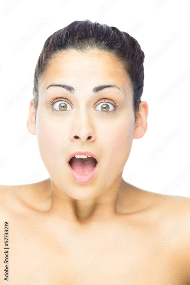Front view of astonished woman looking at camera Front view of astonished woman looking at camera