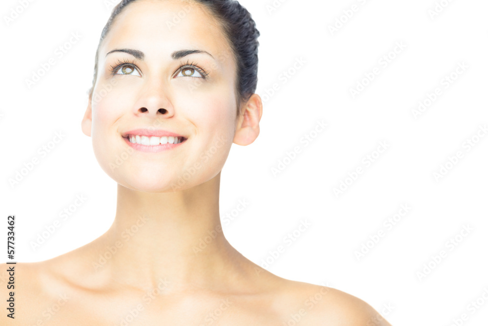 Front view of cheerful brunette woman looking upwards Front view of cheerful brunette woman looking upwards
