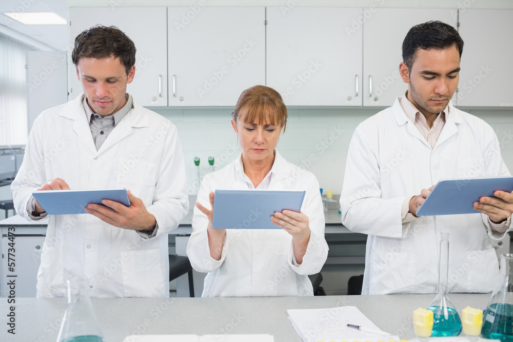Scientists using tablet PCs in the lab Scientists using tablet PCs in the lab