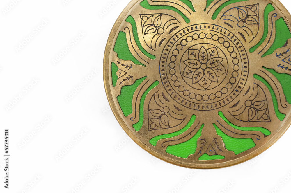 Green circle with gold ethnic ornament