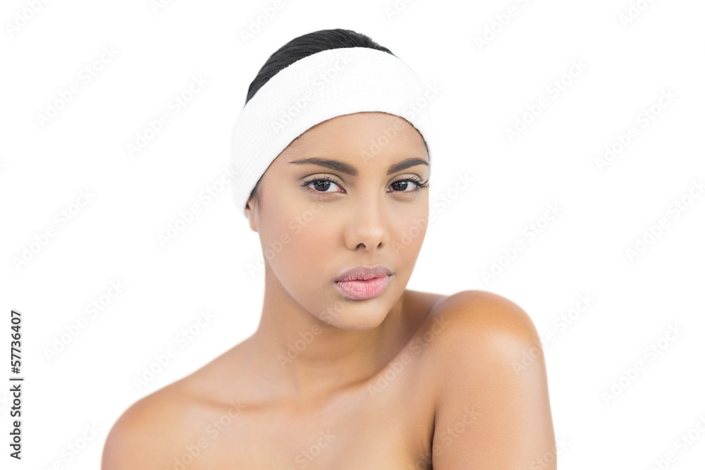 Calm nude brunette with hairband looking at camera Calm nude brunette with hairband looking at camera