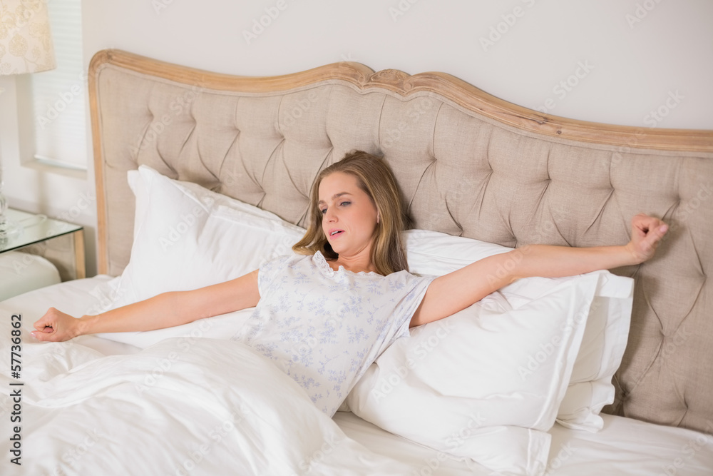 Natural woman yawning and resting in bed Natural woman yawning and resting in bed
