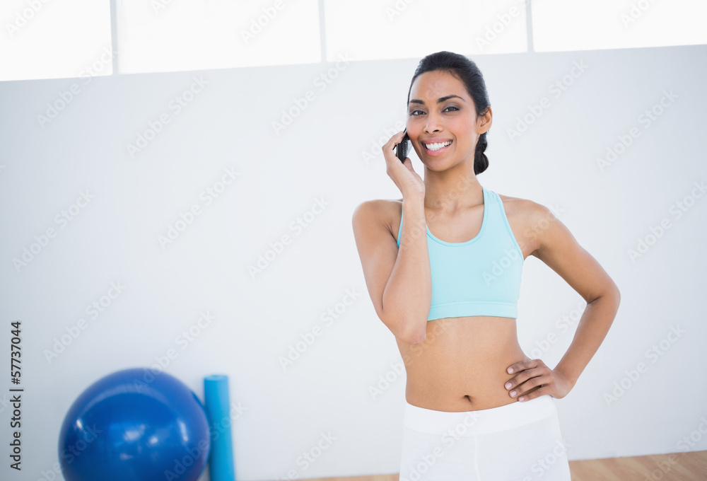 Cheerful slender woman phoning with smartphone Cheerful slender woman phoning with smartphone