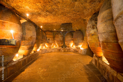 Antique winery in Spain with clay amphora pots photo