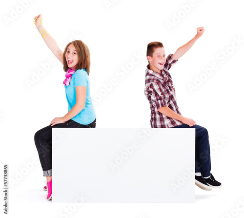 Joyful Kids sitting on Empty Billboard photo