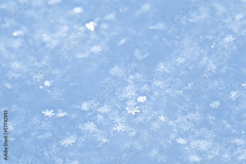 Blue sparkling snow background.