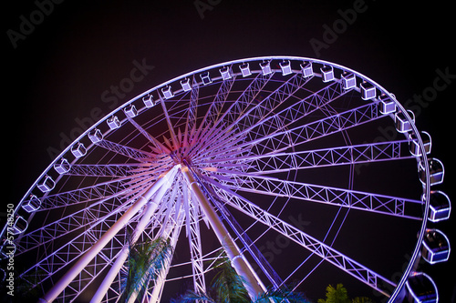 Ferris wheel in motion at amusement park