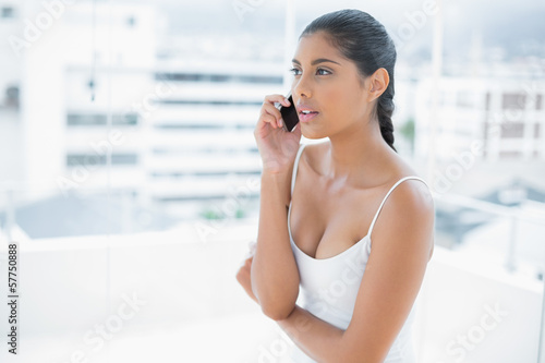 Serious toned brunette phoning on mobile phone Free Download Serious toned brunette phoning on mobile phone - GFXLoad