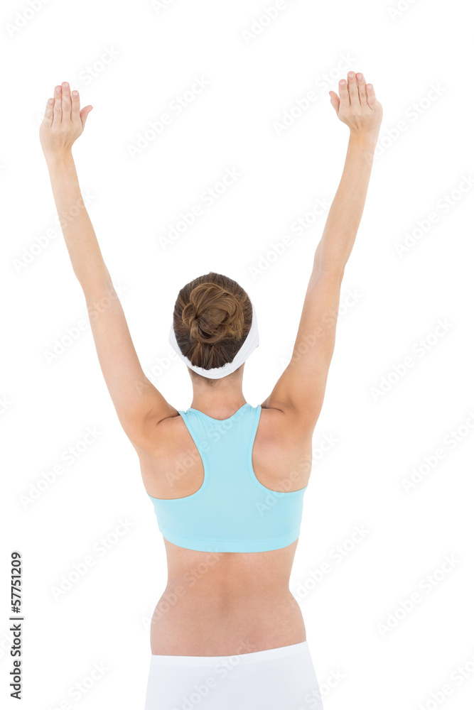 Rear view of brunette woman raising her arms wearing sportswear Rear view of brunette woman raising her arms wearing sportswear