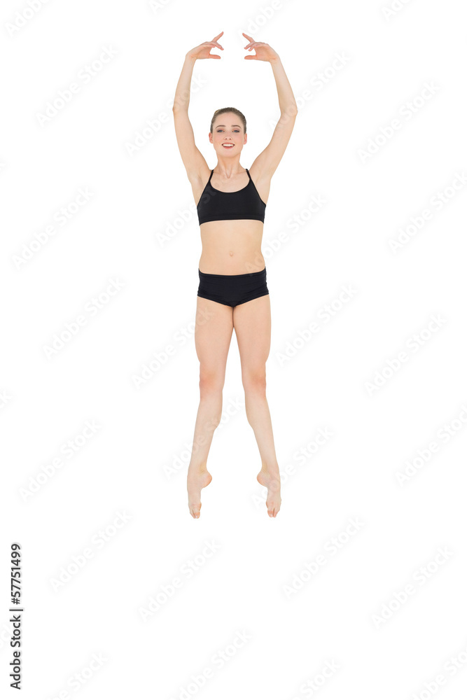 Happy slim ballet dancer jumping in the air Happy slim ballet dancer jumping in the air