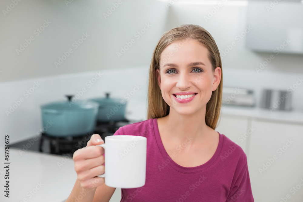 Blonde casual woman holding mug Blonde casual woman holding mug
