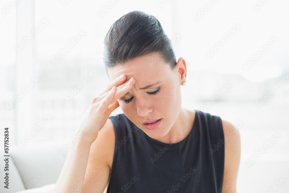 Close-up of a businesswoman suffering from headache Close-up of a businesswoman suffering from headache