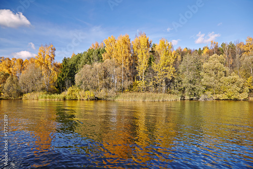 Sunny autumn day on the lake in Russia