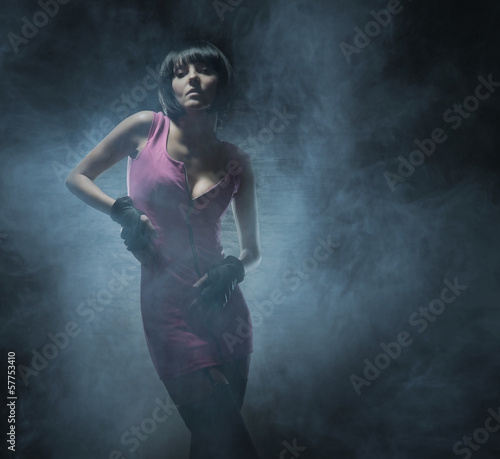 Fashion shoot of a young woman in a fetish dress