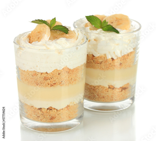 Obraz na plátne Delicious dessert with banana and caramel isolated on white