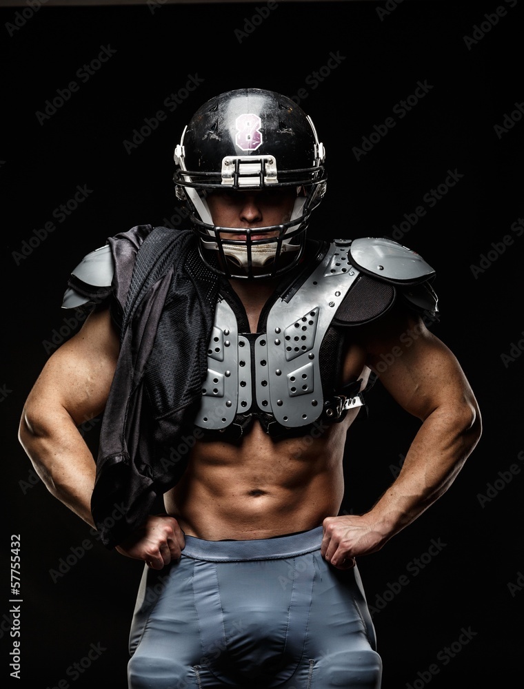 American football player wearing helmet and protective armour American football player wearing helmet and protective armour