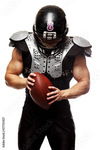 American football player with ball wearing helmet 