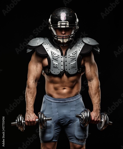 American football player with dumbbells  © Nejron Photo