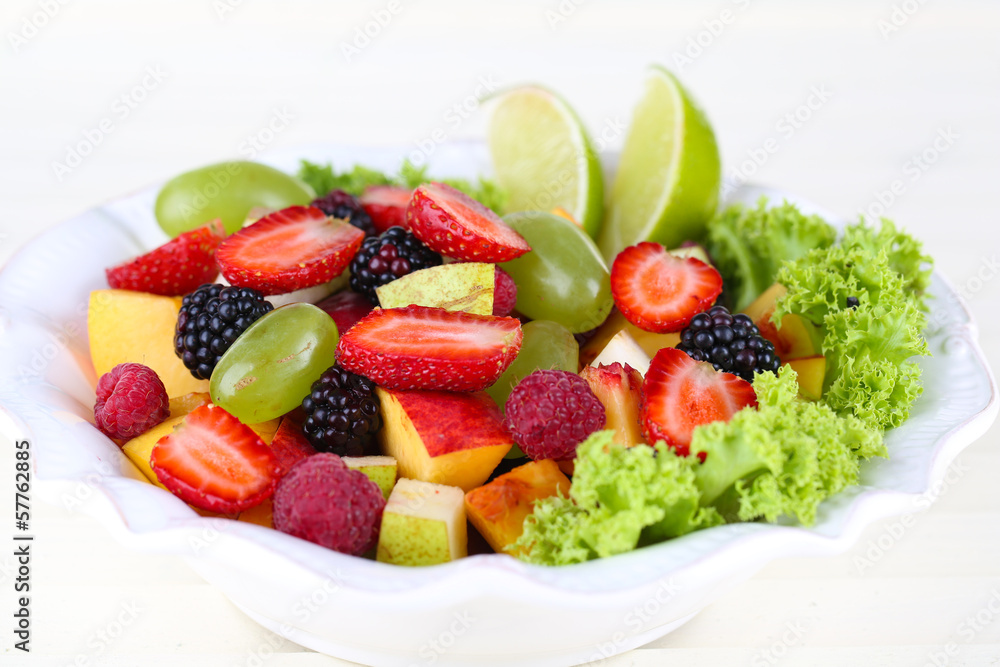 Fruit salad in plate isolated on white Fruit salad in plate isolated on white