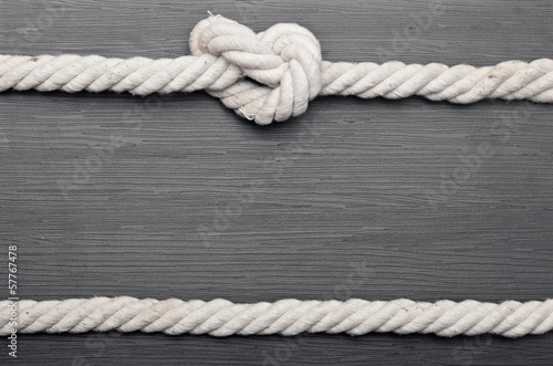 frame made of rope on a wooden background © vadim yerofeyev