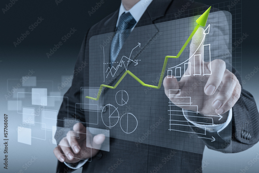 businessman hand drawing a pie chart
