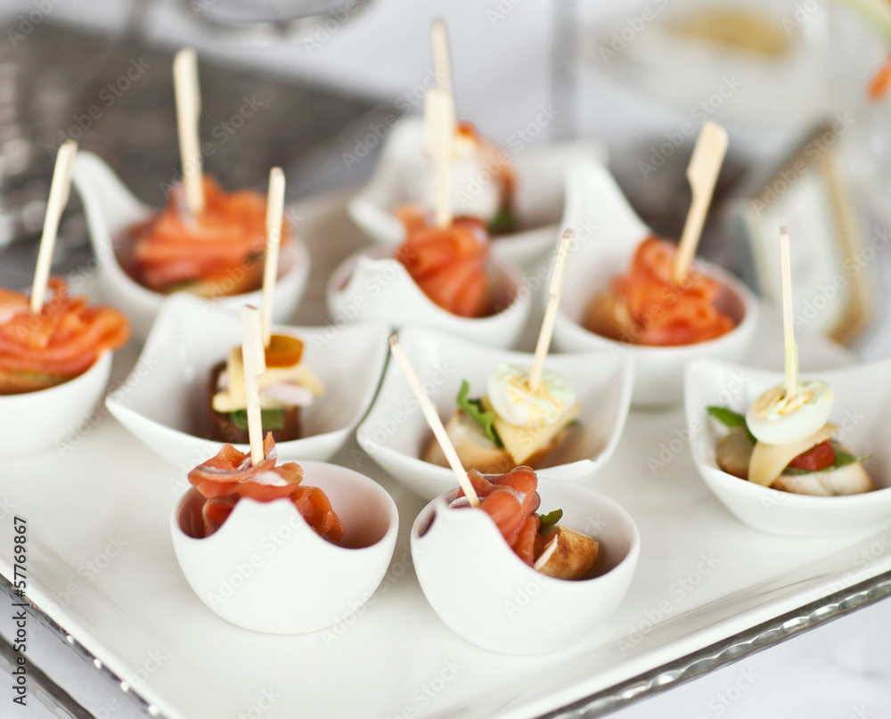 Luxury food and drinks on wedding table. Different sort of canap