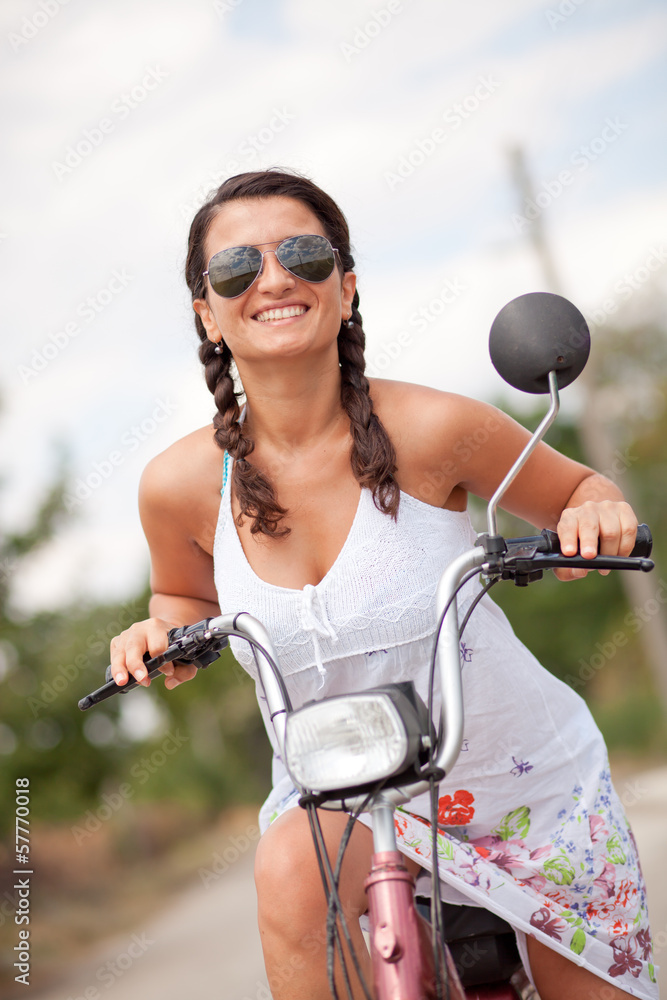 Fototapeta premium Portrait of a young smiling woman with braid hair.