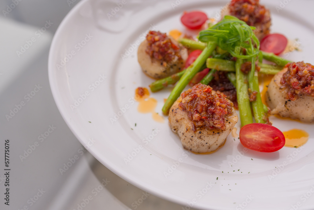 Grilled scallops on white plate Grilled scallops on white plate