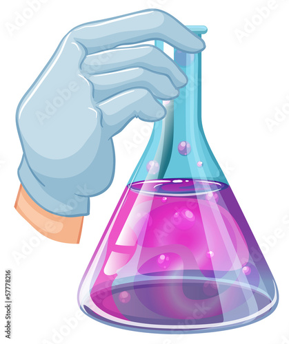 A hand holding a volumetric flask