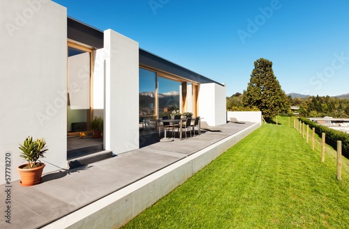 beautiful modern house in cement, view from the garden