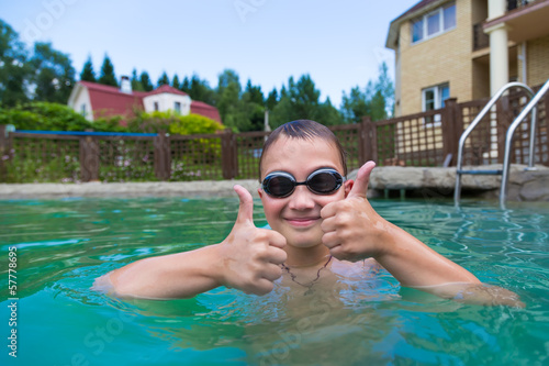 Boy in the pool outdoors © Sergey Lavrentev