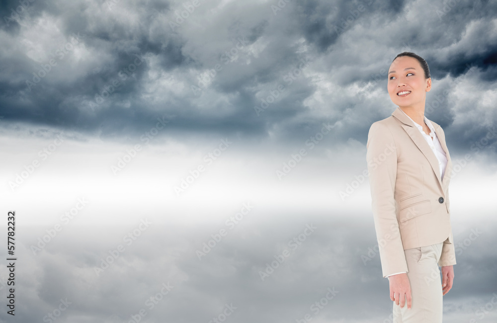 Composite image of smiling asian businesswoman