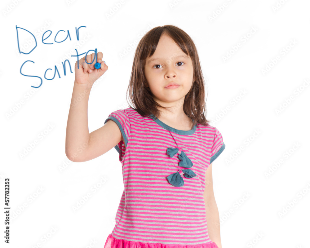 Young girl writing to Santa on imaginary board Young girl writing to Santa on imaginary board