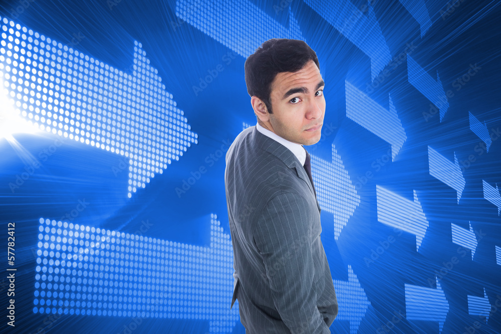 Composite image of unsmiling businessman standing Composite image of unsmiling businessman standing