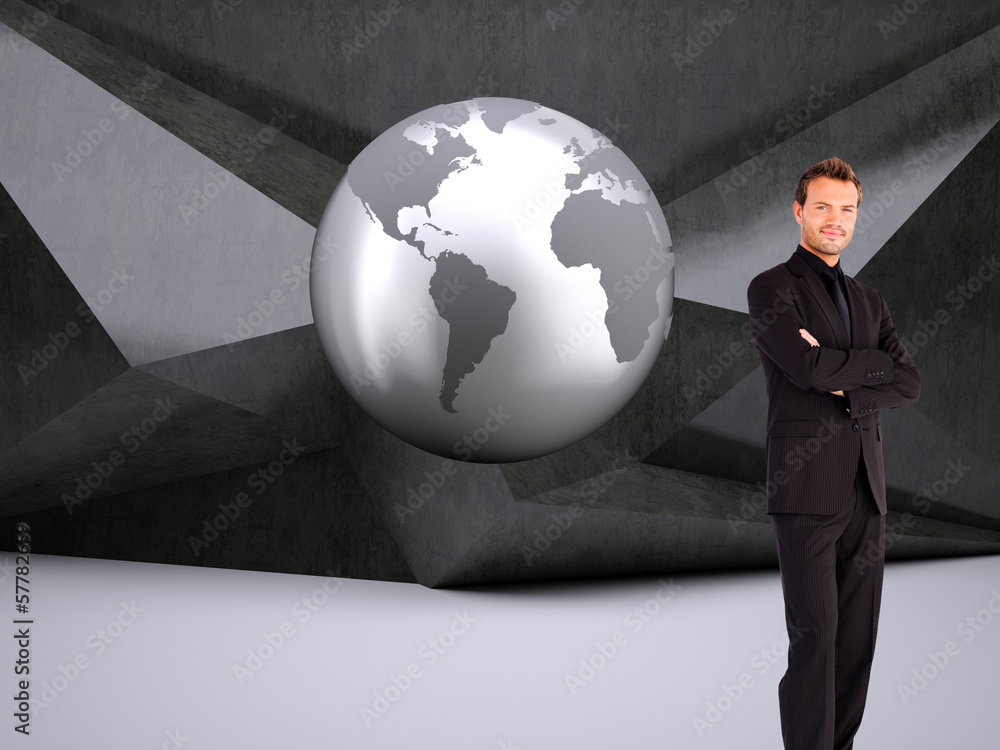 Composite image of handsome businessman with crossed arms Composite image of handsome businessman with crossed arms