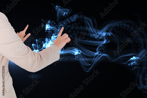 Composite image of businesswoman touching