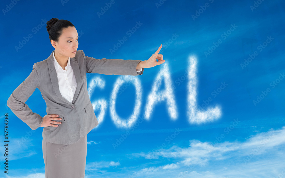 Composite image of unsmiling asian businesswoman pointing Composite image of unsmiling asian businesswoman pointing