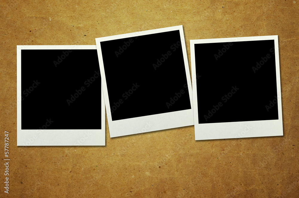 old photo frames on wooden background old photo frames on wooden background