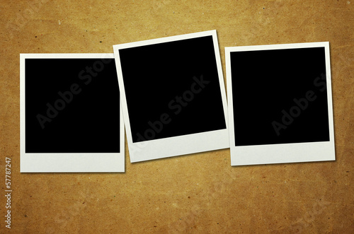 old photo frames on wooden background