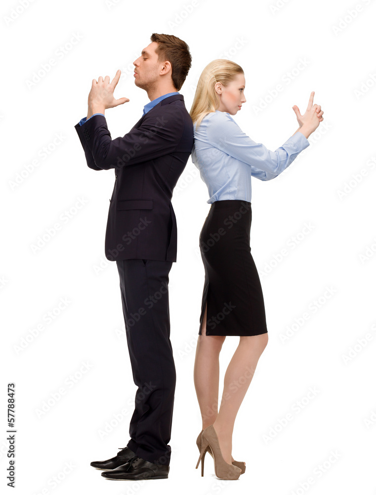 businesswoman and businessman with imaginary guns businesswoman and businessman with imaginary guns