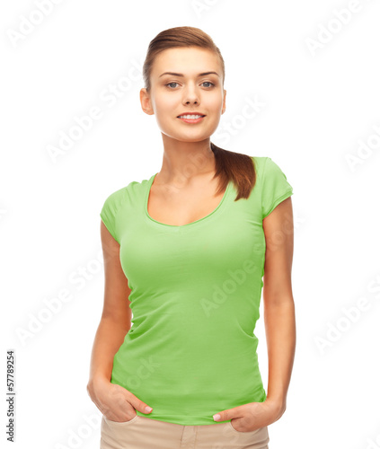 smiling woman in blank green t-shirt © Syda Productions