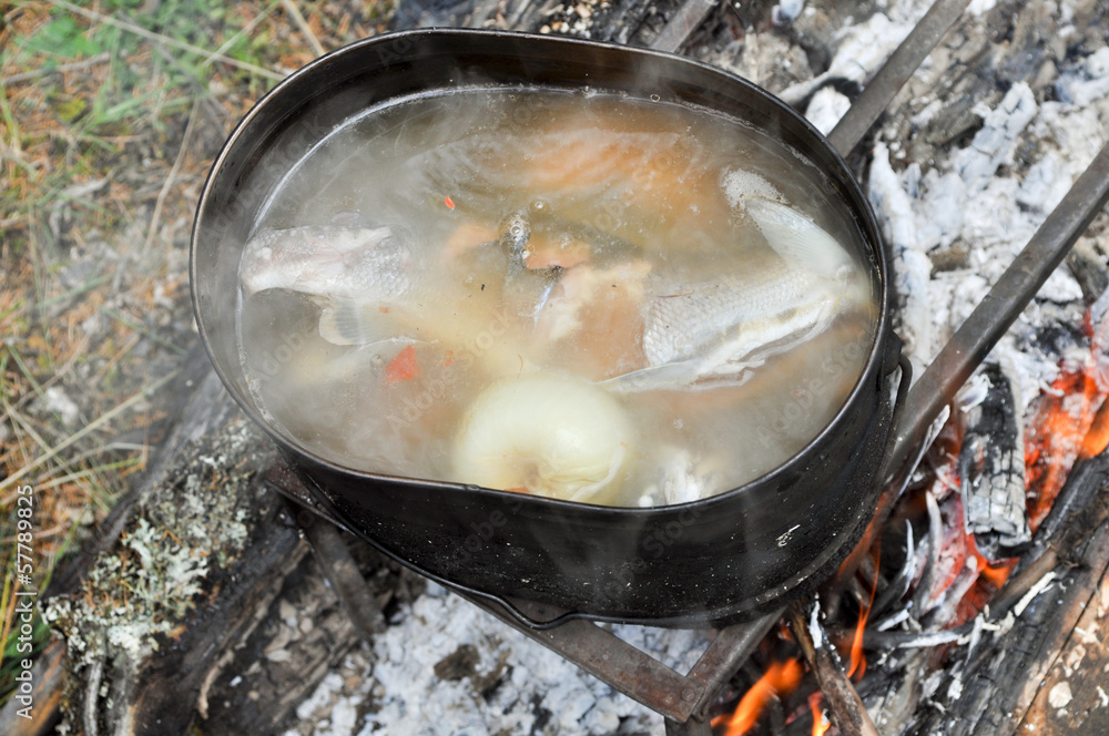 Preparing fish soup on the fire during the trip. Preparing fish soup on the fire during the trip.