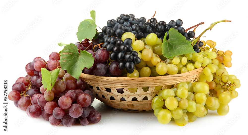 assortment of ripe sweet grapes in basket, isolated on white.