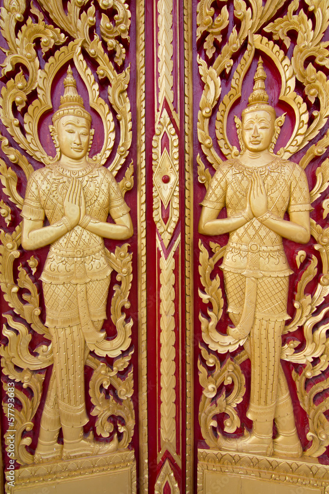 Wood carving temple door in Thailand