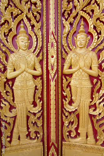 Wood carving temple door in Thailand